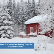 Beautiful winter pine trees with red barn with words what is a nominee realty trust in Massachusetts
