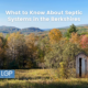 Image of out house surrounded by fall foliage in the Berkshires for article about what to know before you buy septic systems in the berkshires